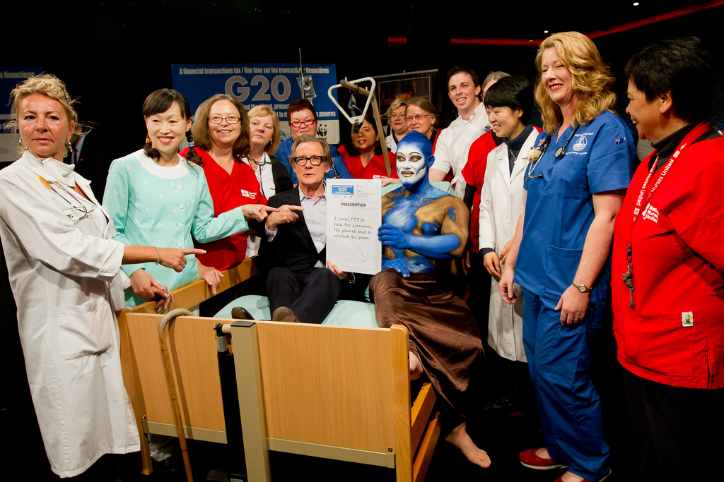 Photo by Gaetan Nerincx    A skit at the Cannes conference had nurses “injecting an FTT” to resuscitate an ailing global economy. British actor and Oxfam Global Ambassador Bill Nighy attended the Cannes press conference.  