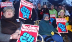 Wisconsin residents holding up Reclaim Wisconsin posters