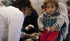 Health workers caring for refugees