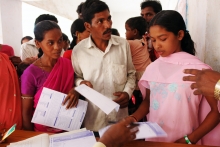 Enrolling for National Health Insurance in India. Photo: ILO