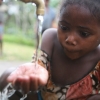 Young girl at a water fountain