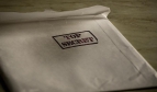 white envelope with Top Secret stamp in black