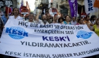 Turkish trade union demonstrators holding a flag