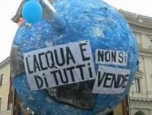 Model of the earth with slogans in Italian