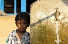 Child near water tap in Nepal, photo by niOS