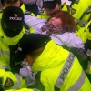 Police removing striking worker from sit-in