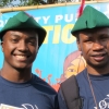Two young men wearing Robin Hood caps