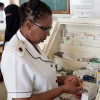 Nurse in South Africa holding a syringe